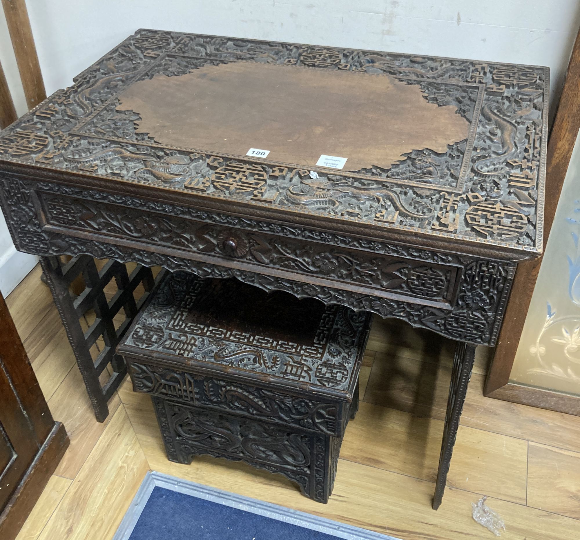 A Chinese carved hongmu folding table, width 83cm depth 56cm height 67cm, and a similar stool/stand, early 20th century